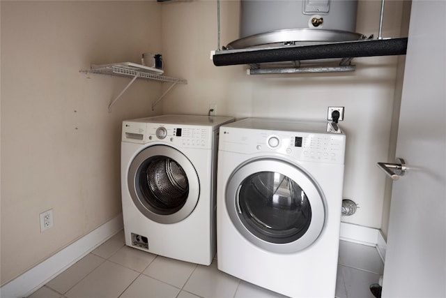 laundry area featuring light tile patterned flooring and independent washer and dryer