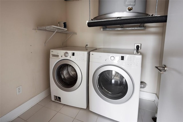 laundry room with light tile patterned floors and independent washer and dryer