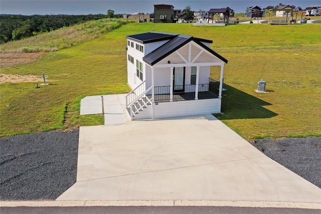 exterior space featuring a front yard and covered porch