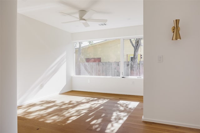 unfurnished room featuring wood-type flooring and ceiling fan