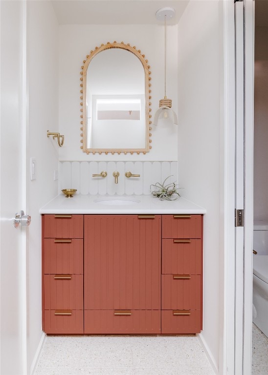 bathroom featuring vanity and toilet