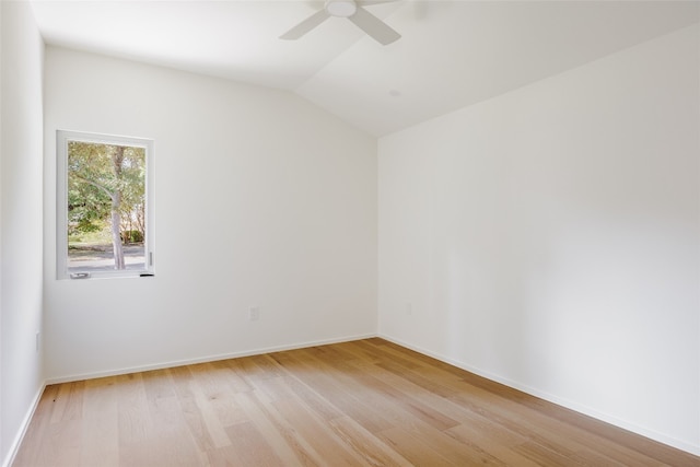 empty room featuring light wood-type flooring, lofted ceiling, and ceiling fan