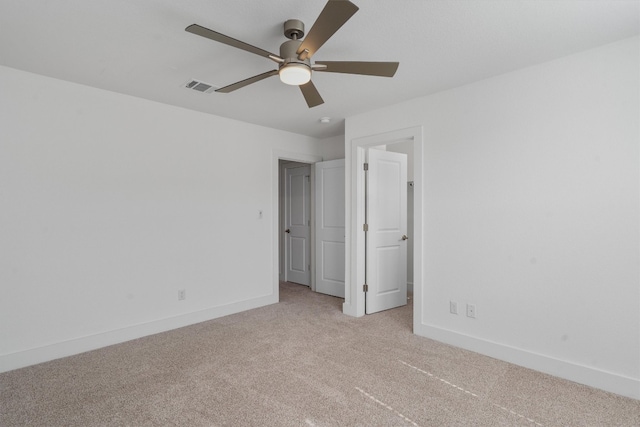 unfurnished bedroom featuring ceiling fan and light carpet