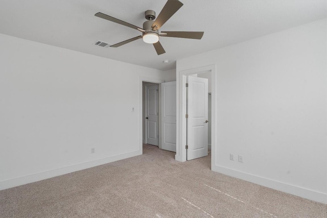 1029 Villa Rialto Vw, Leander, TX 78641 - unfurnished bedroom featuring light carpet, baseboards, and a ceiling fan
