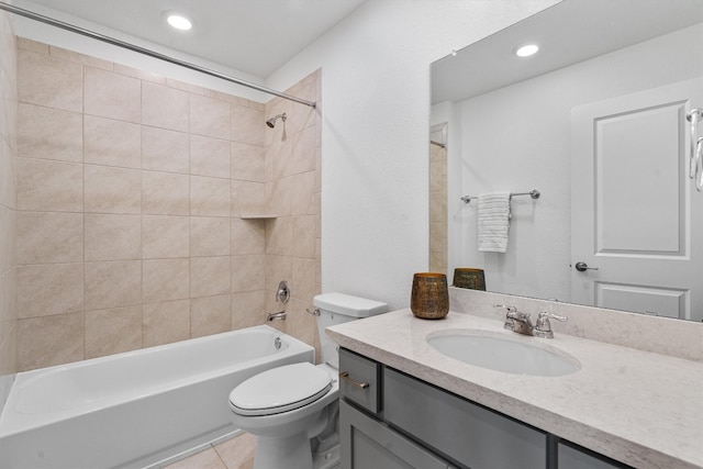 full bathroom featuring tile patterned floors, toilet, vanity, and tiled shower / bath