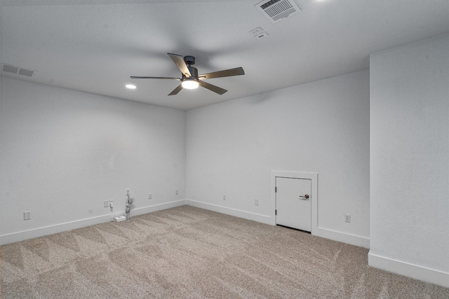 carpeted empty room featuring ceiling fan