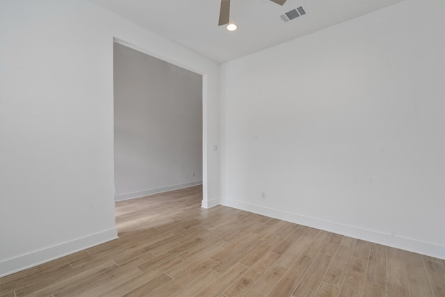 spare room with ceiling fan and light hardwood / wood-style floors