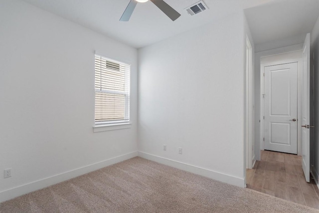 1029 Villa Rialto Vw, Leander, TX 78641 - spare room featuring ceiling fan, baseboards, and light colored carpet