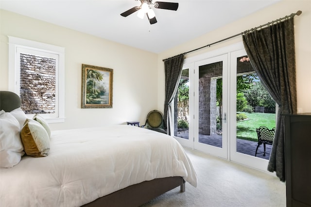 bedroom featuring light carpet, ceiling fan, and access to exterior