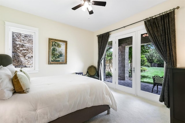 carpeted bedroom with access to exterior and a ceiling fan