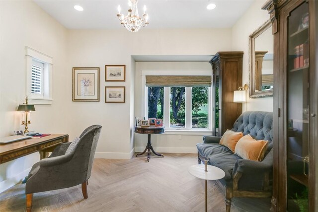 office with light parquet floors and an inviting chandelier