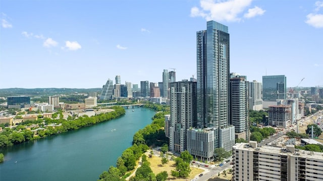 drone / aerial view with a view of city and a water view