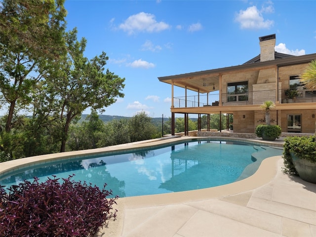 view of pool featuring a patio area