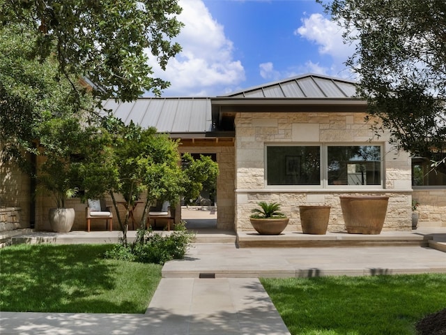 view of front facade with a patio area