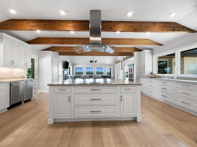 kitchen with light hardwood / wood-style floors, stainless steel dishwasher, white cabinetry, and a kitchen island