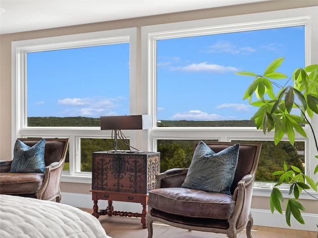 living area featuring plenty of natural light and hardwood / wood-style floors