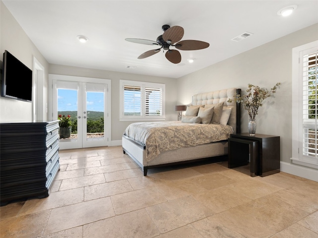 bedroom featuring french doors, ceiling fan, multiple windows, and access to outside