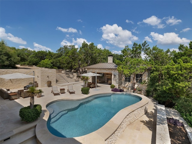 view of pool featuring a patio and a gazebo