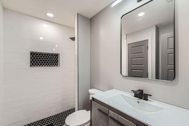 1707 Spyglass Dr Unit 60, Austin, TX 78746 - full bathroom with a tile shower, vanity, and recessed lighting
