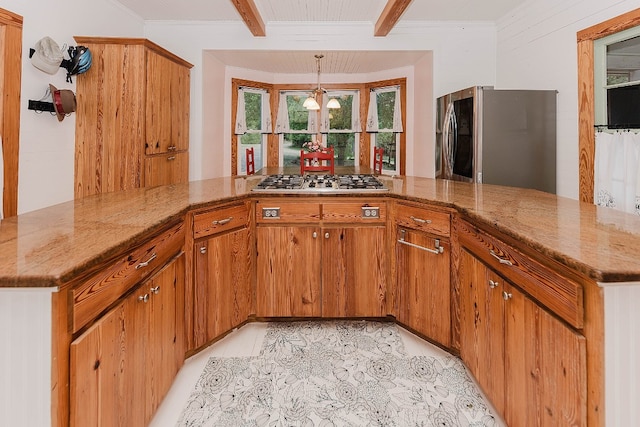 kitchen featuring hanging light fixtures, light tile patterned floors, beam ceiling, kitchen peninsula, and appliances with stainless steel finishes