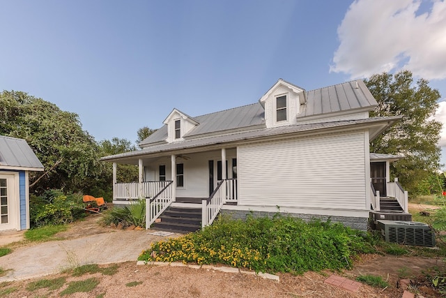 view of front of home with cooling unit and covered porch