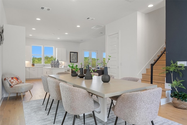 dining area featuring light wood-type flooring