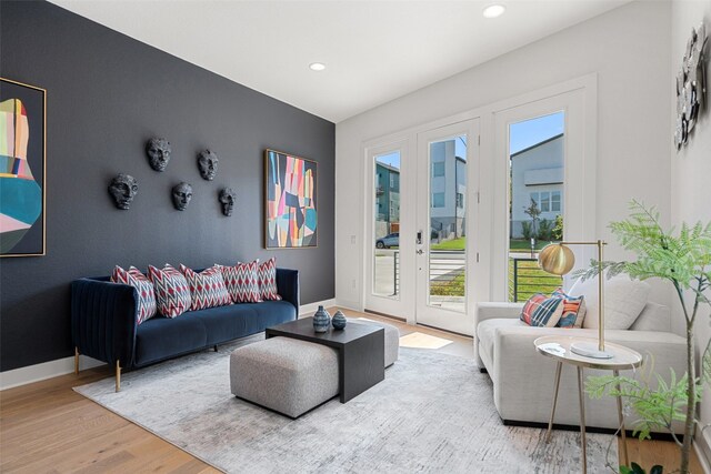 living room with french doors and hardwood / wood-style floors