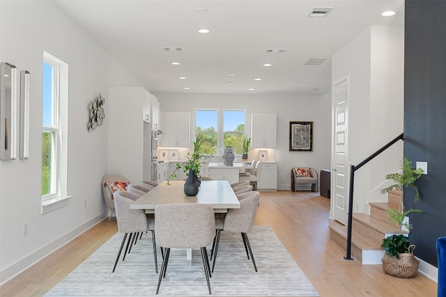 dining area featuring light wood-type flooring