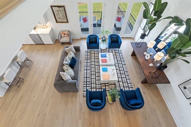 living room with light hardwood / wood-style flooring and a wealth of natural light