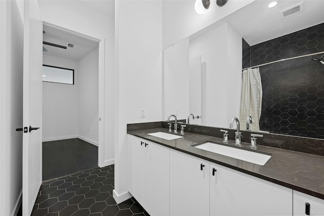 bathroom with vanity, tile patterned flooring, and curtained shower