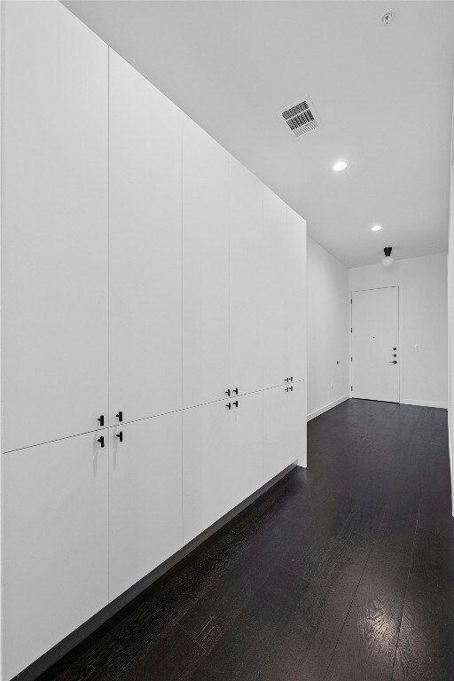 hallway featuring dark wood-type flooring