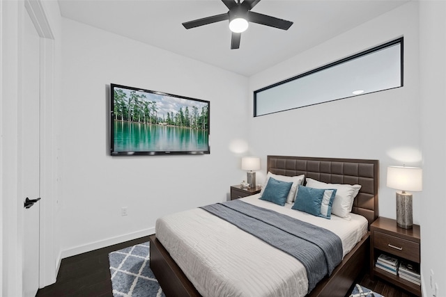 bedroom featuring ceiling fan and dark hardwood / wood-style flooring