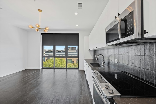 kitchen featuring white cabinetry, appliances with stainless steel finishes, and sink