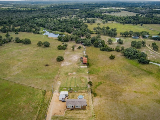 birds eye view of property featuring a water view and a rural view