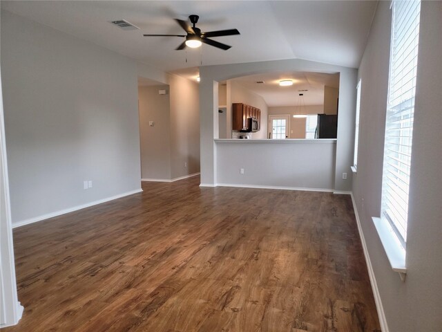 unfurnished living room featuring dark hardwood / wood-style floors, ceiling fan, and lofted ceiling