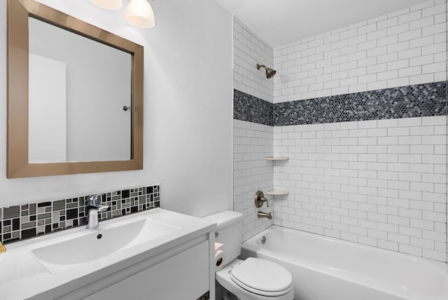 full bathroom featuring tiled shower / bath combo, vanity, backsplash, and toilet