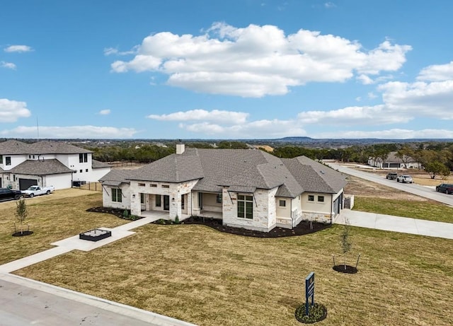 french country style house featuring a front lawn