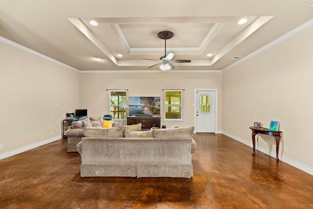 living room featuring a raised ceiling, crown molding, and ceiling fan