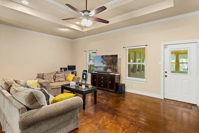 living room with crown molding, ceiling fan, and a raised ceiling