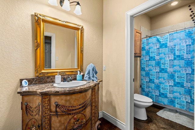 bathroom with curtained shower, vanity, and toilet