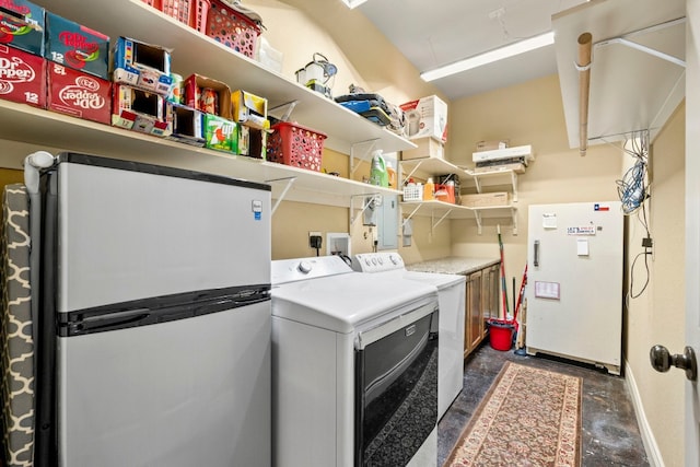 washroom featuring washer and clothes dryer