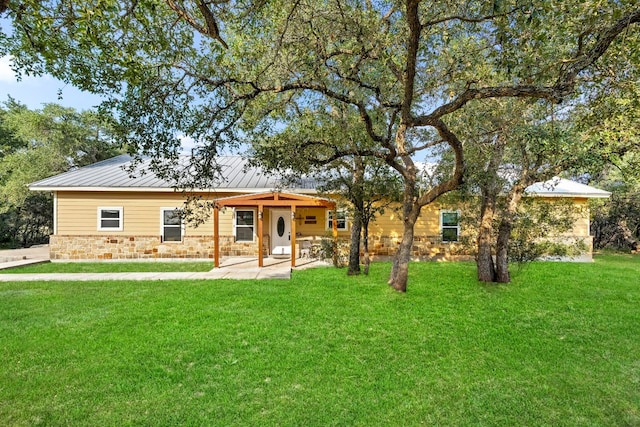 rear view of property with a yard