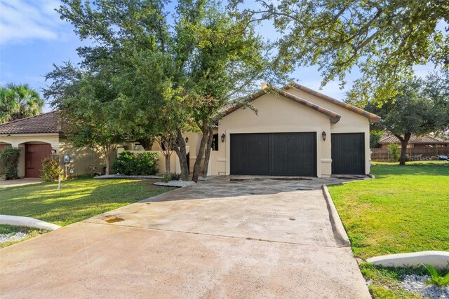 15009 General Williamson, Austin, TX 78734 - view of front of property featuring driveway, an attached garage, and stucco siding