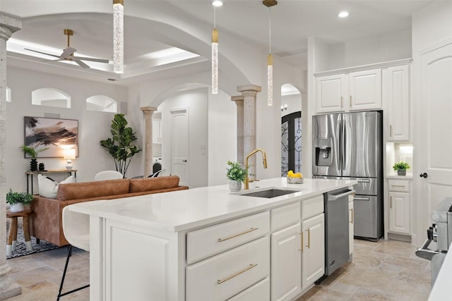 15009 General Williamson, Austin, TX 78734 - kitchen with decorative columns, arched walkways, a sink, appliances with stainless steel finishes, and recessed lighting