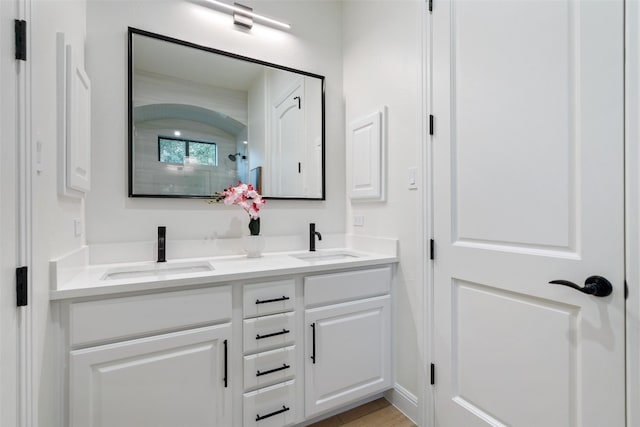 bathroom featuring vanity and hardwood / wood-style flooring