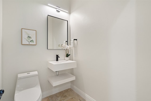 bathroom with sink and toilet