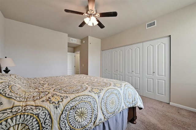 bedroom with a closet, carpet floors, and ceiling fan