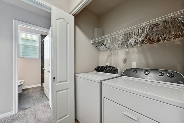 washroom featuring light tile patterned floors and washer and dryer