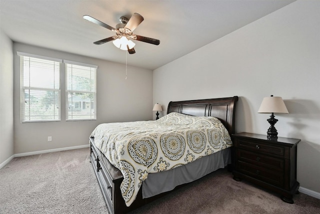 bedroom featuring dark carpet and ceiling fan