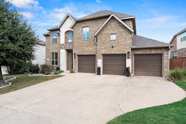 view of front facade featuring a garage and a front lawn